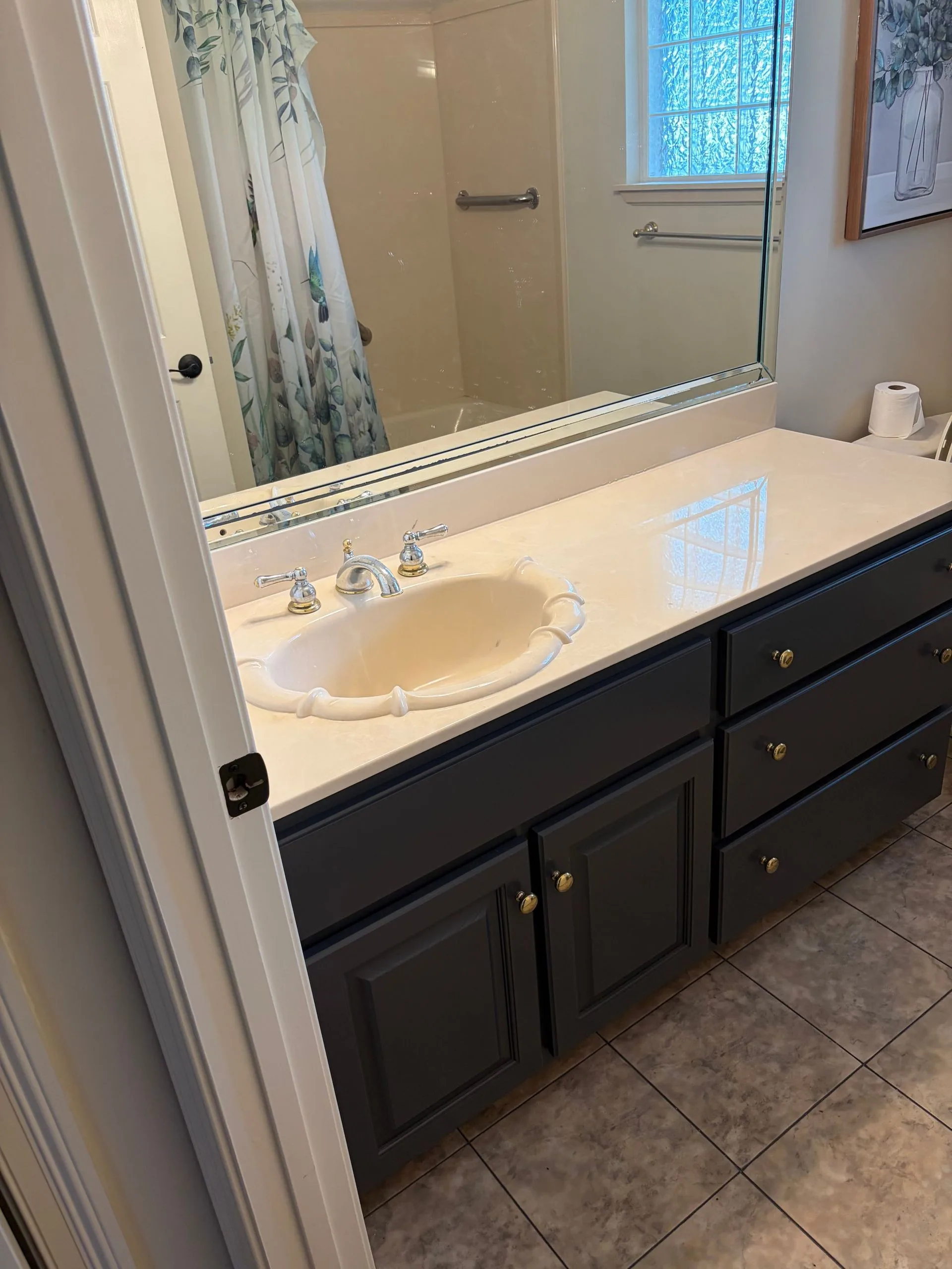 Bathroom vanity repainted deep navy by 3H Construction
