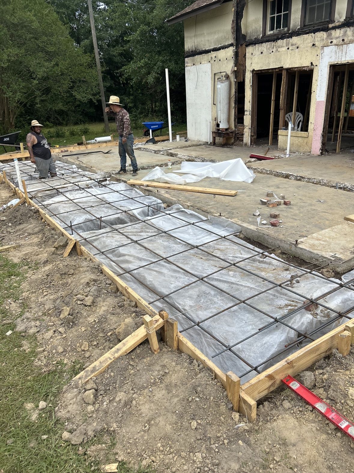 Foundation forms with rebar laid for a home addition by 3H Construction