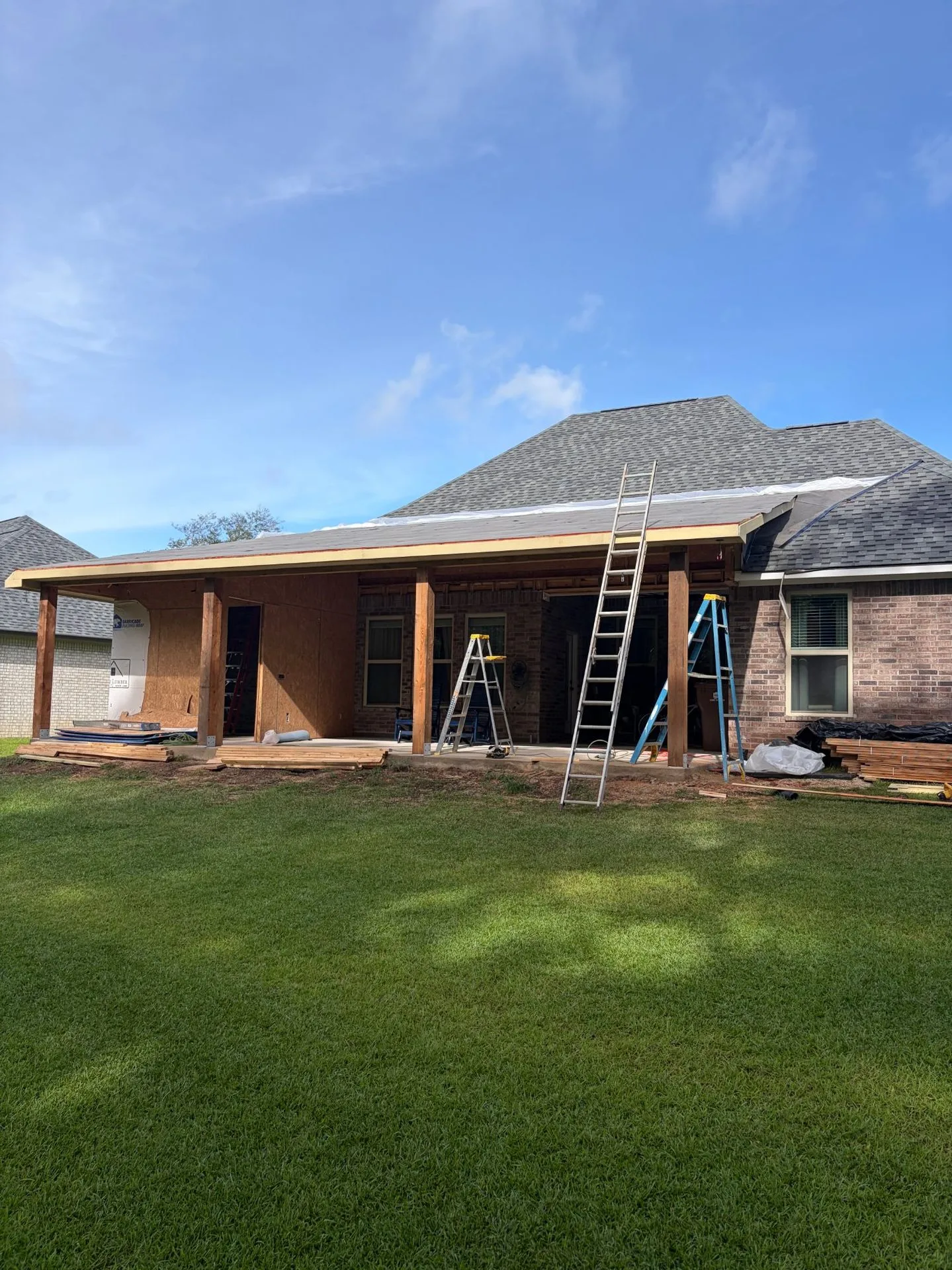 Porch roof with decking and fascia being installed by 3H Construction
